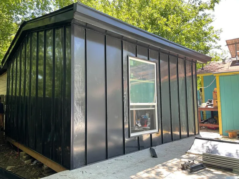 Black standing seam metal wall panels for Roof Inspection in Pahokee