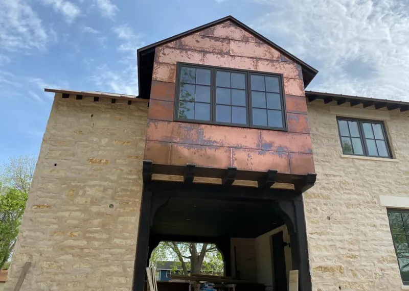 Copper metal panel facade on a stone building for Skylight Installation in Pahokee